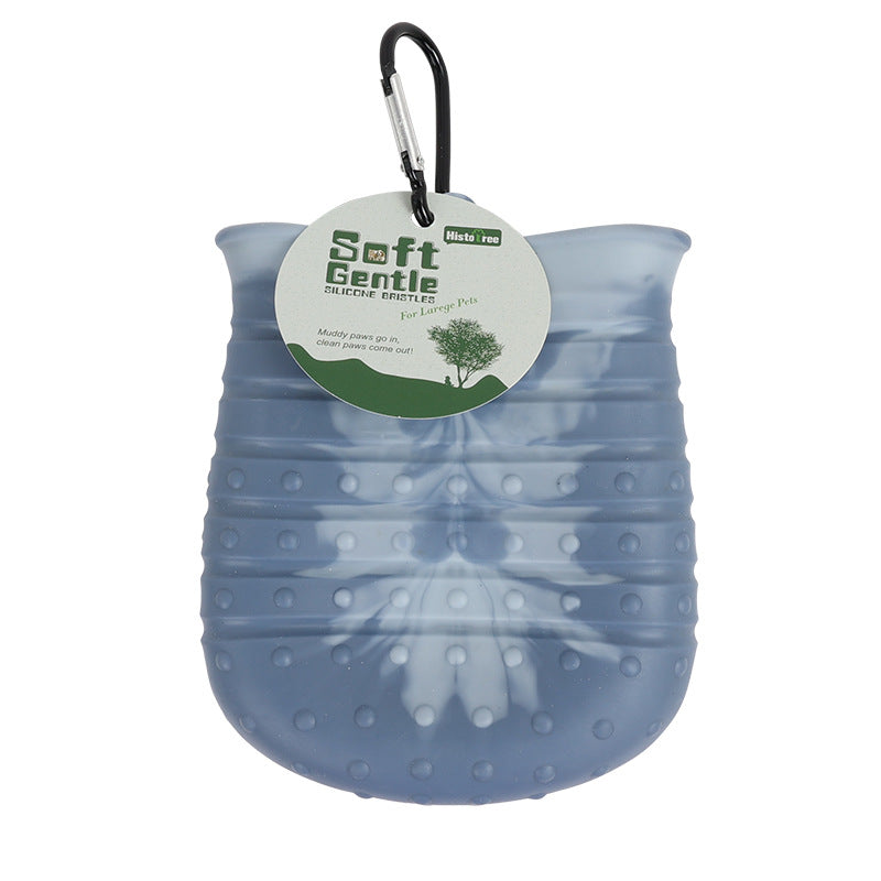 Blue dog paw cleaner with a carabiner and 'Soft Gentle' label on a white background