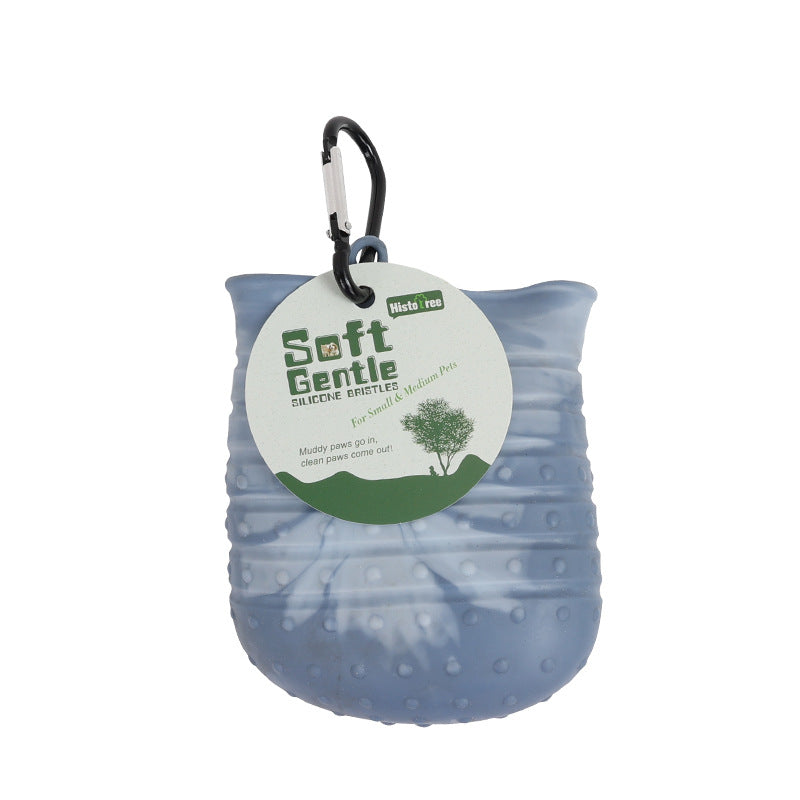 Blue dog paw cleaner with a carabiner and 'Soft Gentle' label on a white background