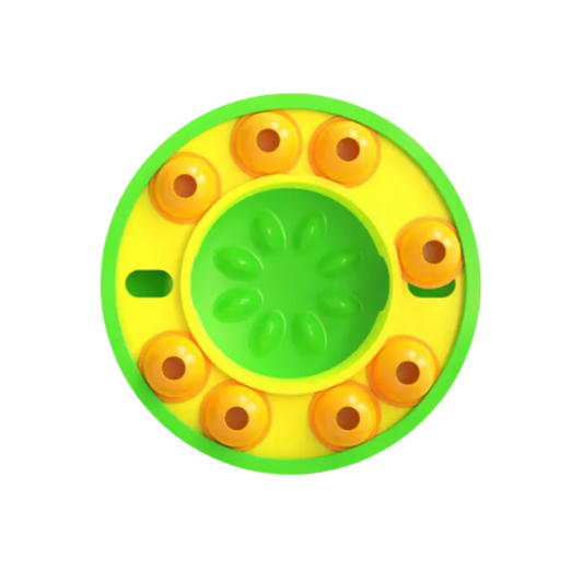 Round yellow and green dog slow puzzle feeder with a central circular design on a white background