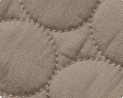 Close-up of quilted fabric for cooling dogs in summer heats with a diamond and circular pattern