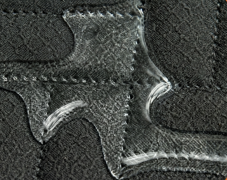 Close-up of a textured fabric surface with water reppelent material