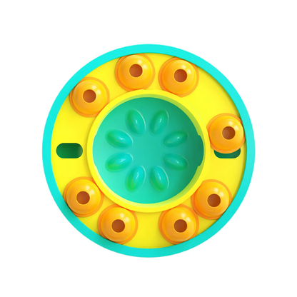 Colorful circular dog slow puzzle feeder with yellow and blue accents on a white background